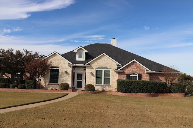 view of front of home with a front yard