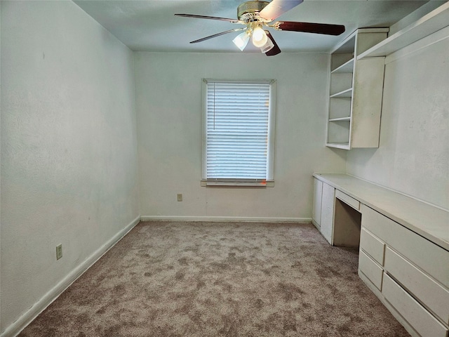 spare room with light carpet and ceiling fan