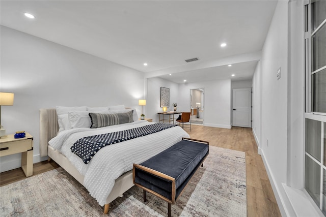 bedroom with hardwood / wood-style flooring