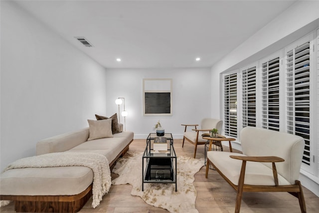 living room with light hardwood / wood-style floors