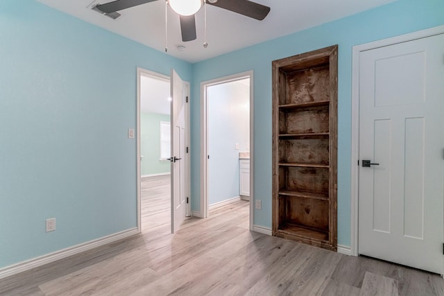 spare room featuring ceiling fan and light hardwood / wood-style floors