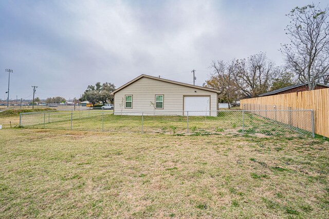 rear view of house with a yard