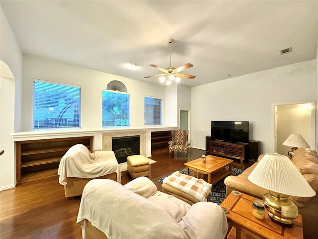 living room with ceiling fan and wood-type flooring