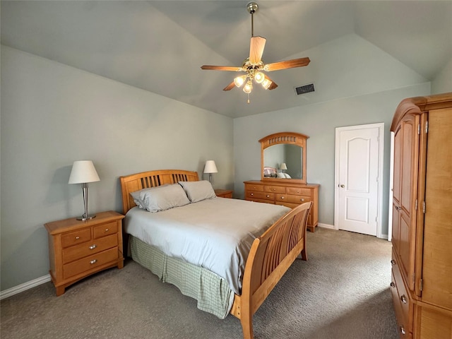 bedroom featuring ceiling fan, vaulted ceiling, and dark colored carpet