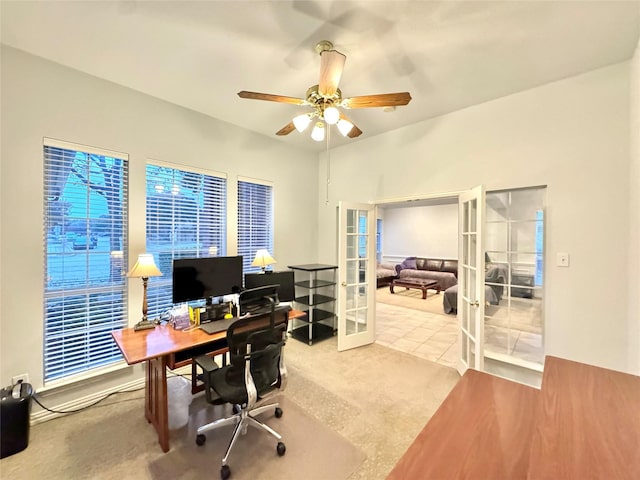 carpeted office featuring ceiling fan and french doors