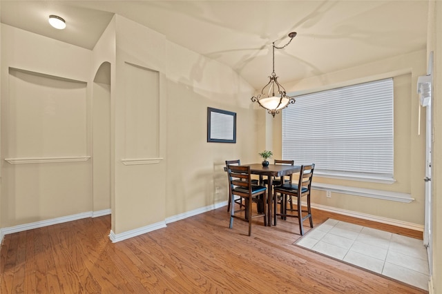 dining room with wood-type flooring