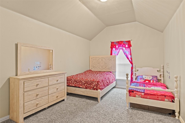 carpeted bedroom with lofted ceiling