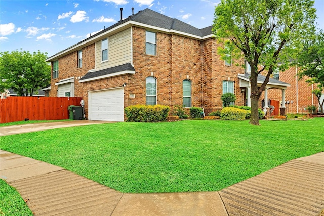 view of front of house with a front yard and a garage