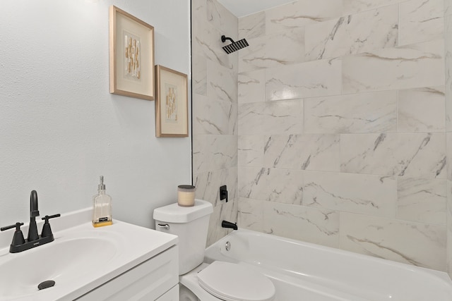 full bathroom featuring vanity, toilet, and tiled shower / bath