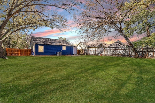 yard at dusk with central AC