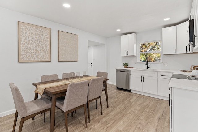 dining area featuring light hardwood / wood-style floors and sink