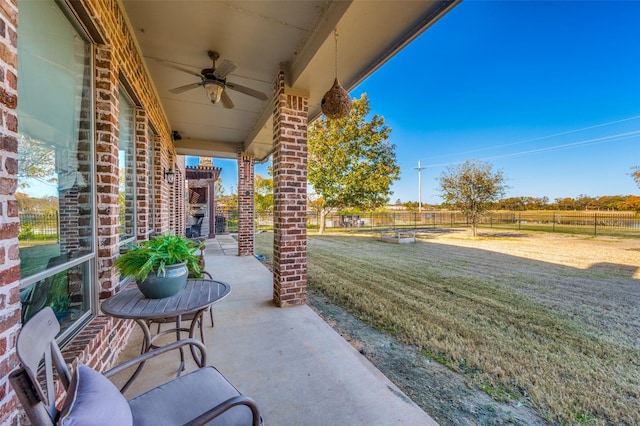 view of patio / terrace with a rural view and ceiling fan