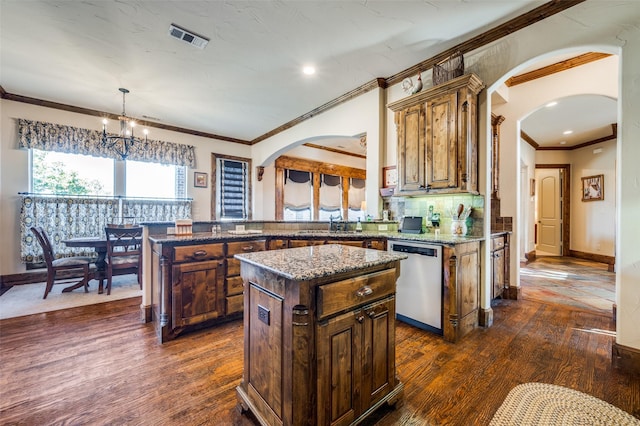 117 Woodland Dr, Krugerville, TX 76227 - kitchen featuring stainless steel dishwasher, arched walkways, dark wood-style flooring, a chandelier, and crown molding