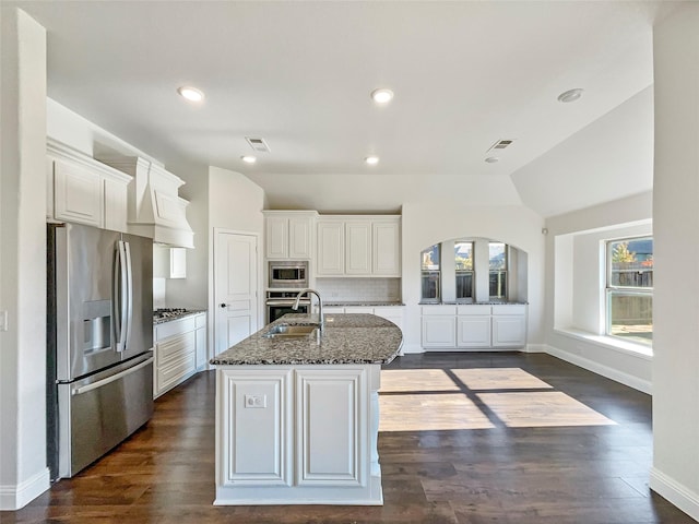 kitchen with white cabinetry, a kitchen island with sink, a healthy amount of sunlight, and appliances with stainless steel finishes