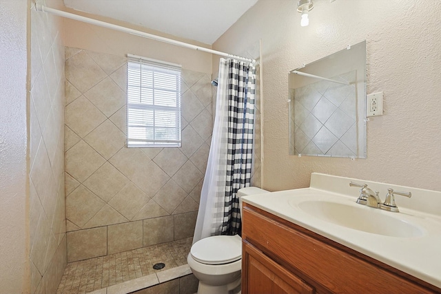 bathroom with vanity, toilet, and curtained shower