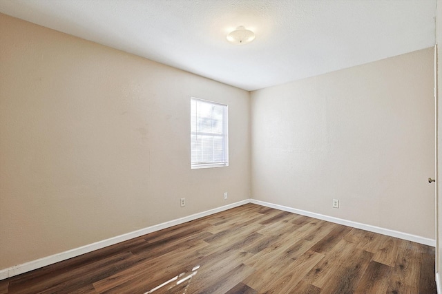 unfurnished room featuring hardwood / wood-style floors