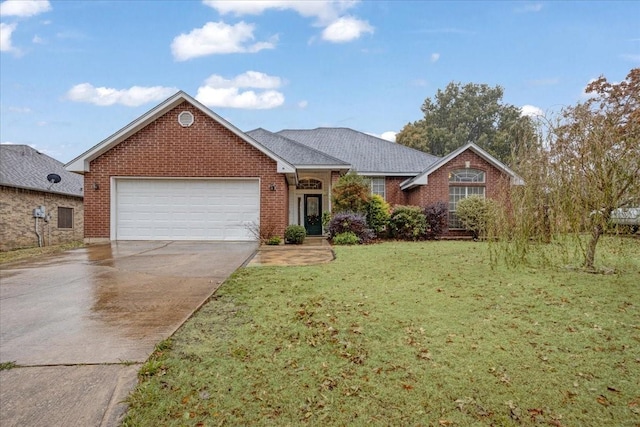 view of front of house with a garage and a front lawn