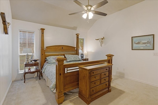 bedroom featuring light carpet, vaulted ceiling, and ceiling fan