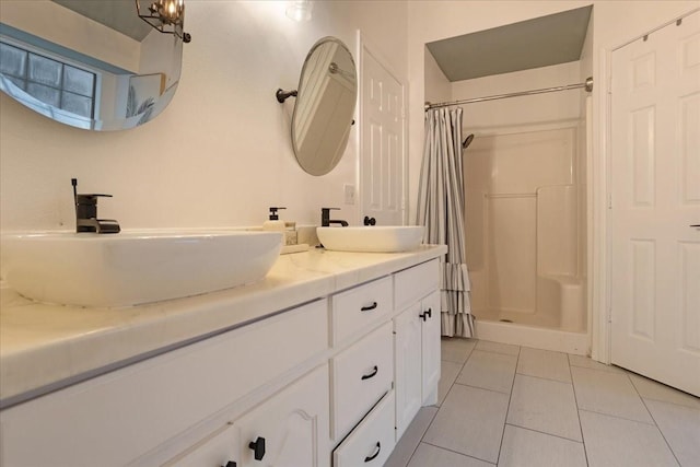 bathroom featuring tile patterned flooring, vanity, and a shower with shower curtain