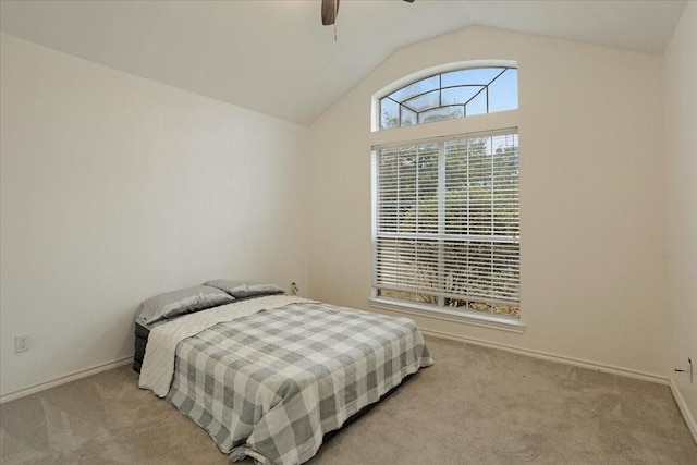 carpeted bedroom featuring ceiling fan and lofted ceiling