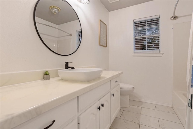 full bathroom featuring vanity, shower / tub combo, and toilet