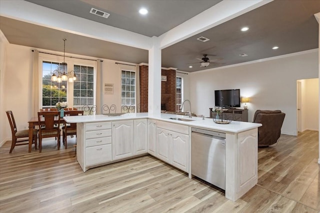 kitchen featuring white cabinetry, sink, stainless steel dishwasher, kitchen peninsula, and light hardwood / wood-style floors