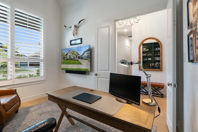 home office featuring hardwood / wood-style flooring and plenty of natural light