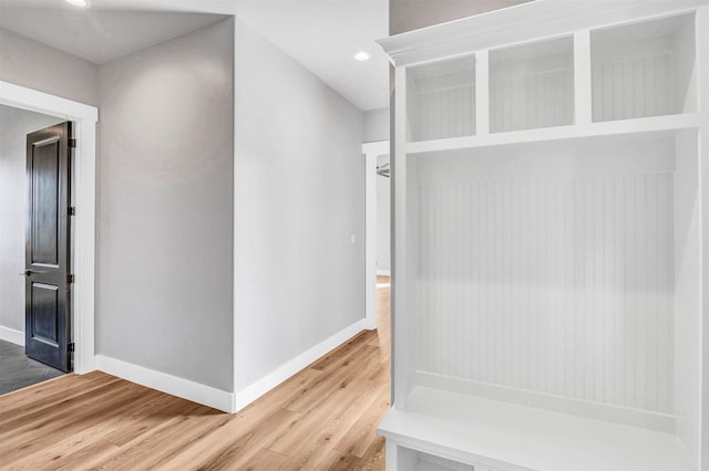 mudroom with wood-type flooring