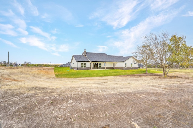 ranch-style home with a front lawn