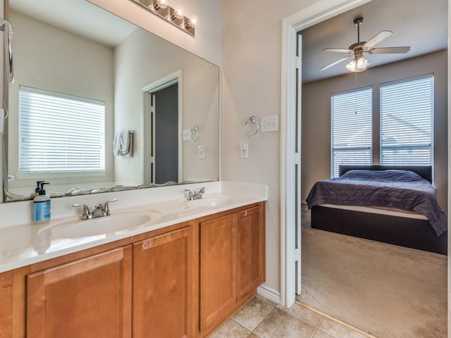 bathroom with tile patterned floors, vanity, ceiling fan, and a wealth of natural light