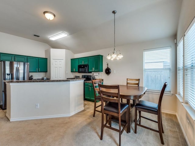 kitchen featuring light carpet, stainless steel refrigerator with ice dispenser, decorative light fixtures, and vaulted ceiling