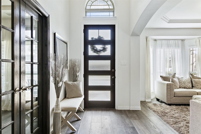 foyer entrance featuring hardwood / wood-style floors and french doors