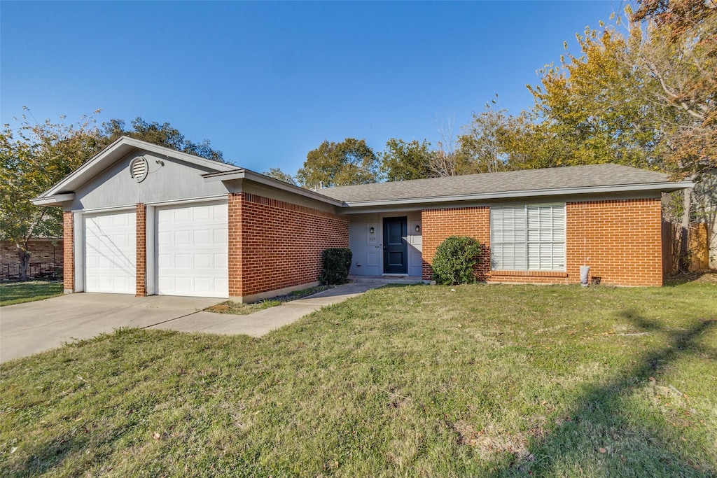 single story home with a garage and a front lawn