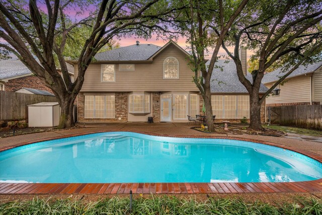 front of property with a garage and a yard