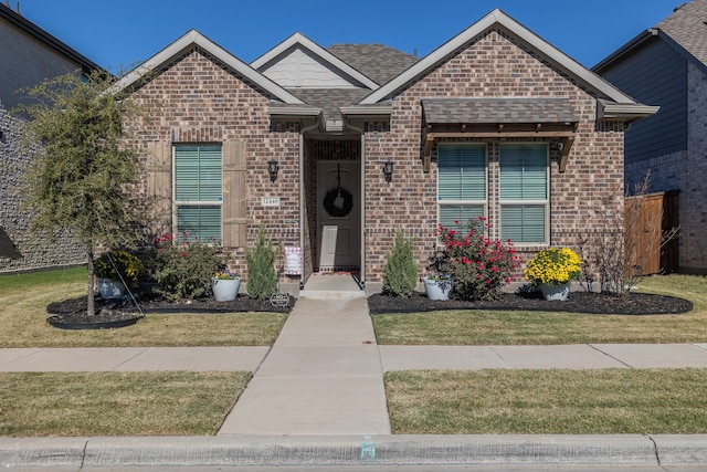 view of front of home with a front lawn