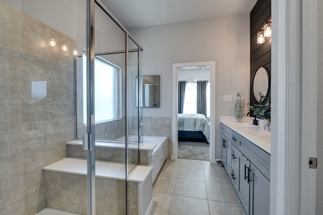 bathroom featuring tile patterned floors, vanity, and separate shower and tub