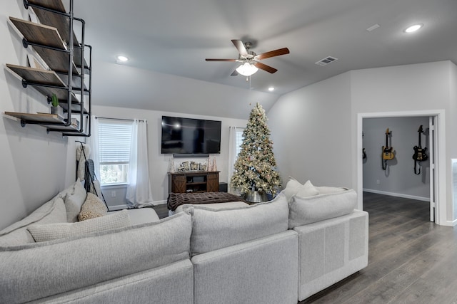 living room with vaulted ceiling, ceiling fan, and dark wood-type flooring