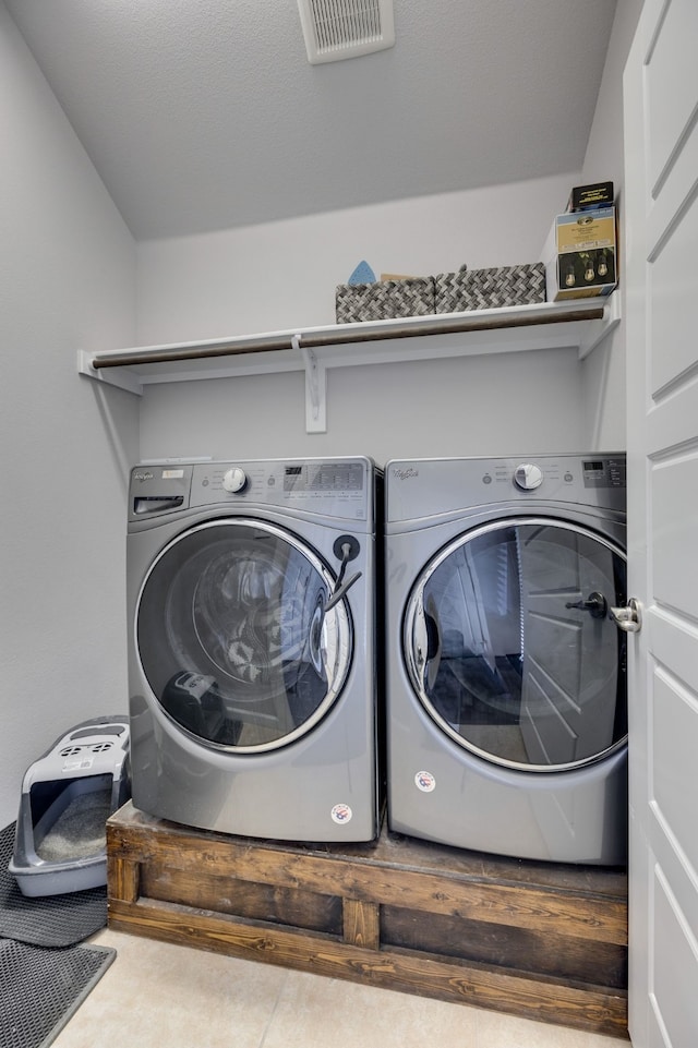 washroom featuring washing machine and dryer