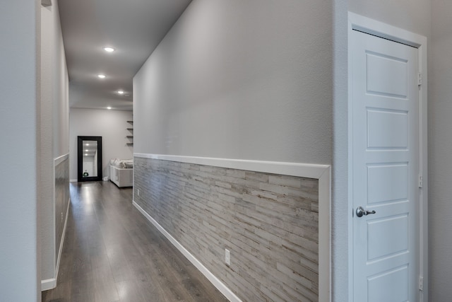 hall with dark hardwood / wood-style flooring