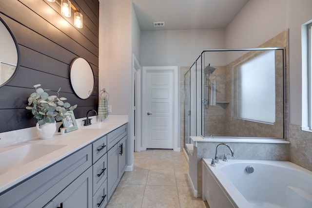 bathroom with tile patterned flooring, vanity, separate shower and tub, and wood walls