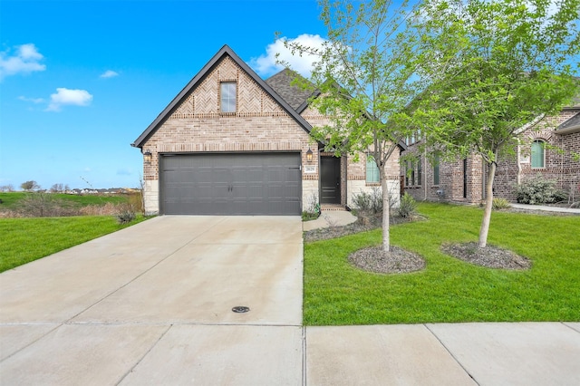 view of front of home featuring a garage and a front yard