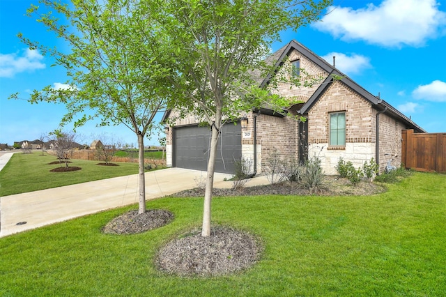 view of side of property with a yard and a garage