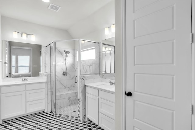 bathroom with vaulted ceiling, vanity, and an enclosed shower