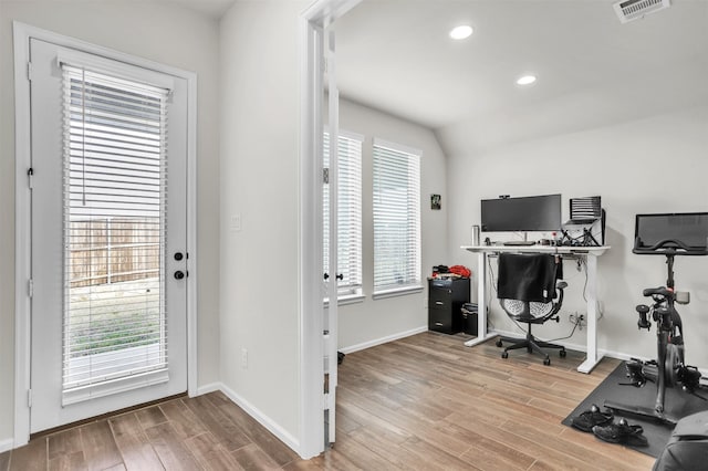 office with lofted ceiling and wood-type flooring