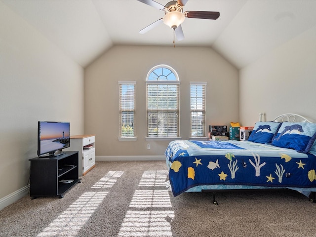 carpeted bedroom with vaulted ceiling and ceiling fan