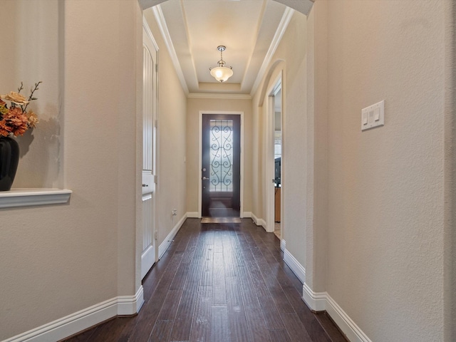 entryway with dark hardwood / wood-style flooring and ornamental molding