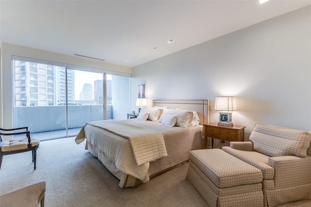 bedroom featuring carpet flooring and access to exterior