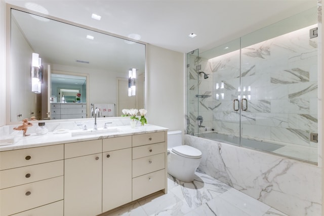 full bathroom featuring vanity, enclosed tub / shower combo, and toilet