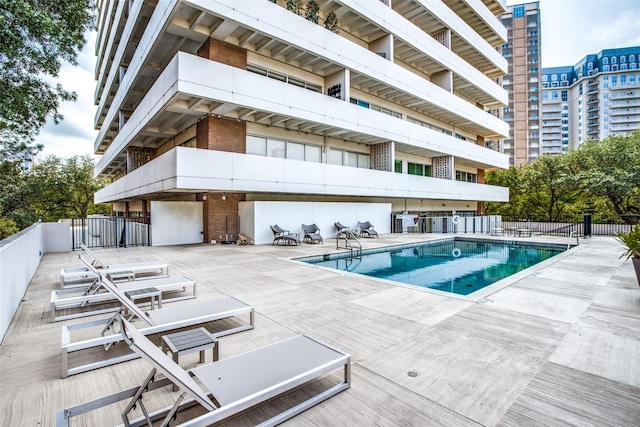 view of swimming pool with a patio