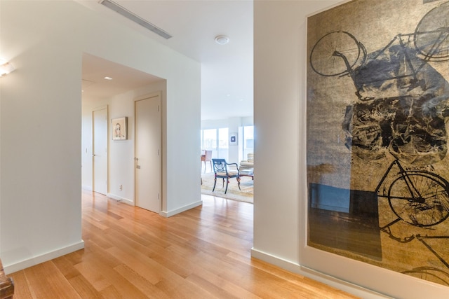 corridor featuring hardwood / wood-style floors